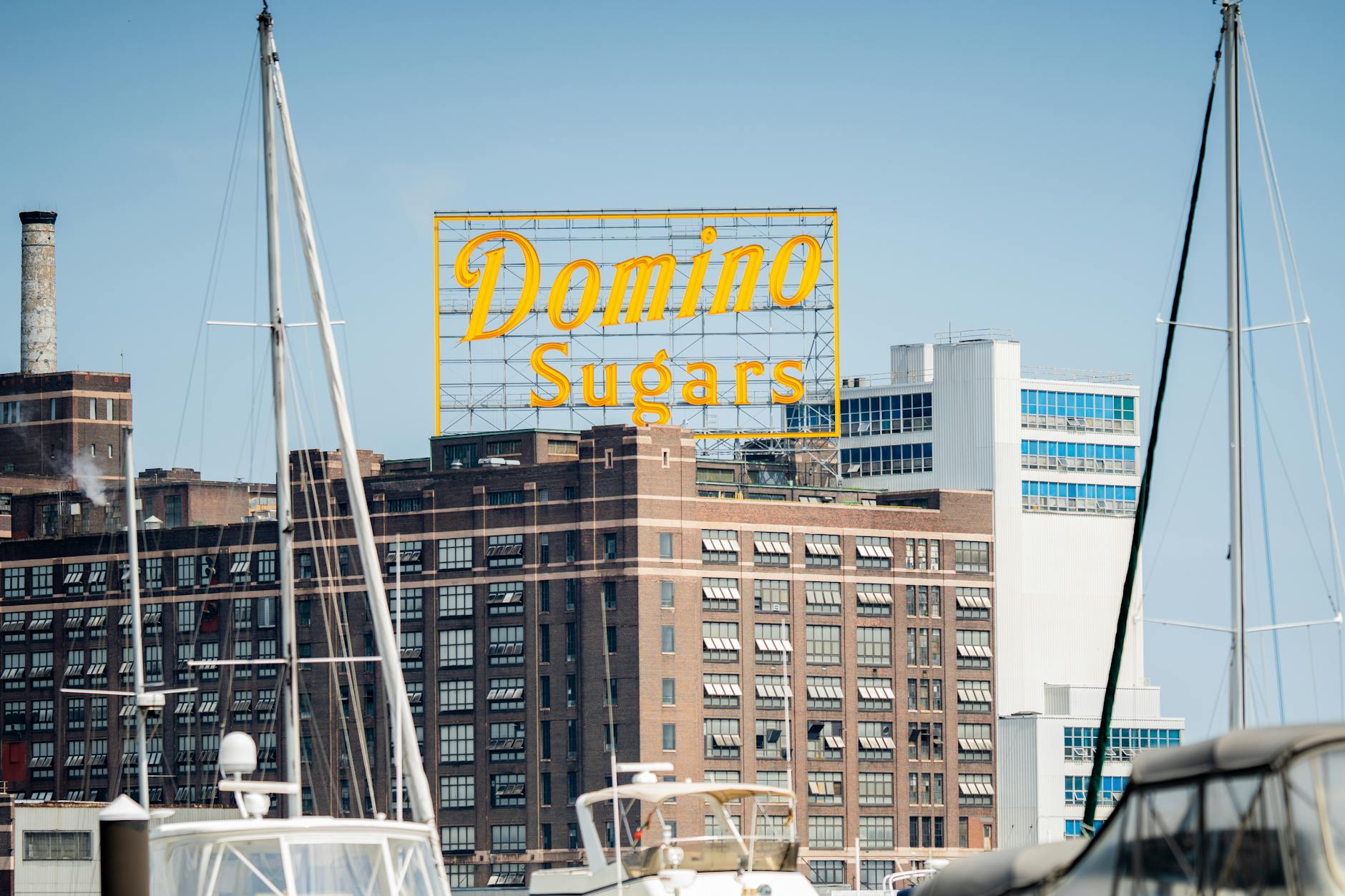 neon signage on top of a high rise building